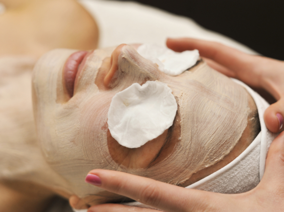 a woman relaxes during a beauty treatment