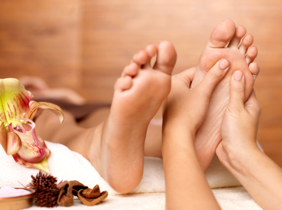 Massage of human foot in spa salon - Soft focus image